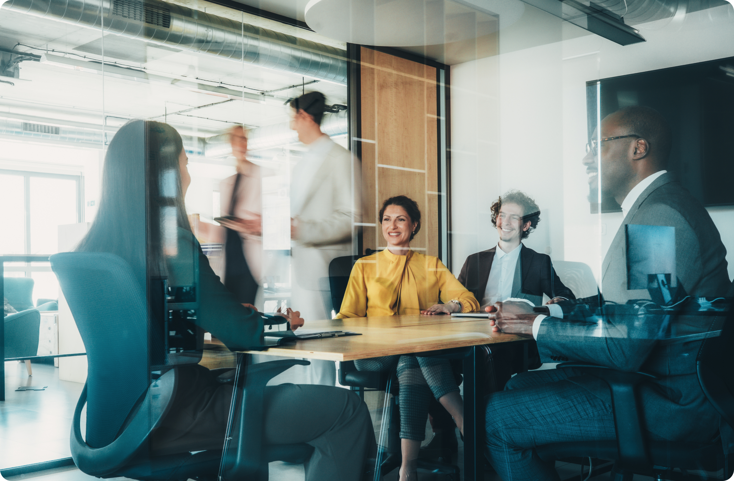 People sitting around a table in a conference room.